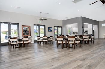 A room with wooden floors and a ceiling fan at 55+ FountainGlen Valencia, Valencia
